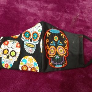 Embroidered sugar skull mask.